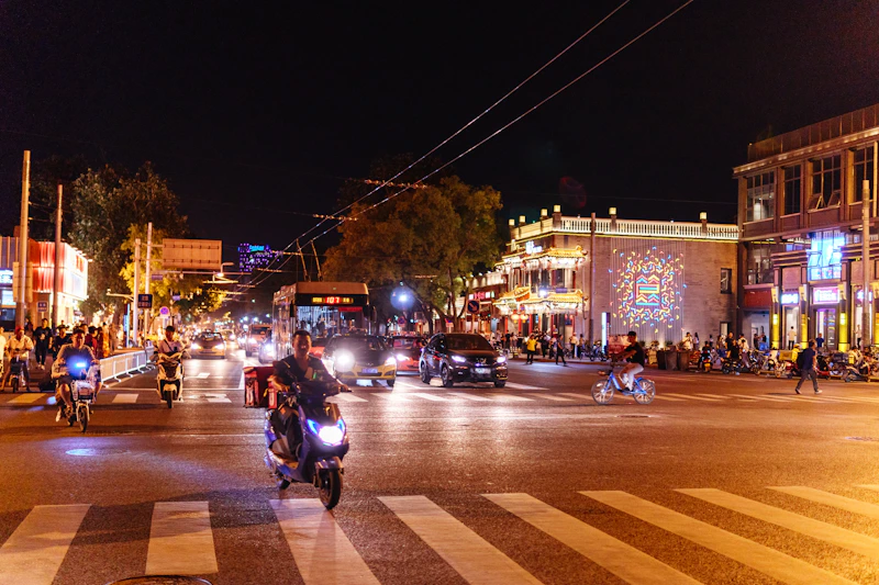 A city street at night with a lot of traffic