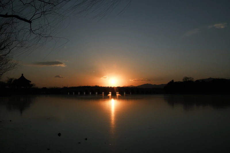 Sunset over a bridge and calm water