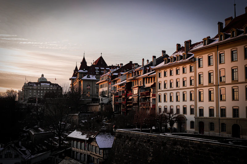 a row of buildings with snow on top of them