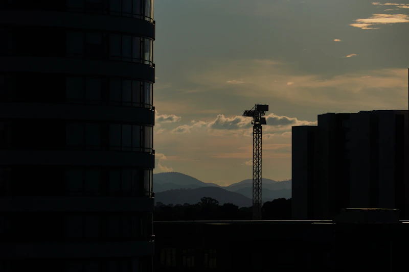 a tall tower with a cross on top of it