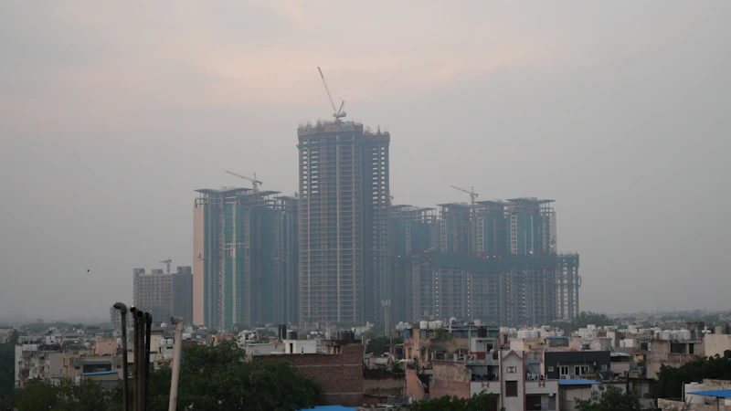 a view of a city with tall buildings under construction