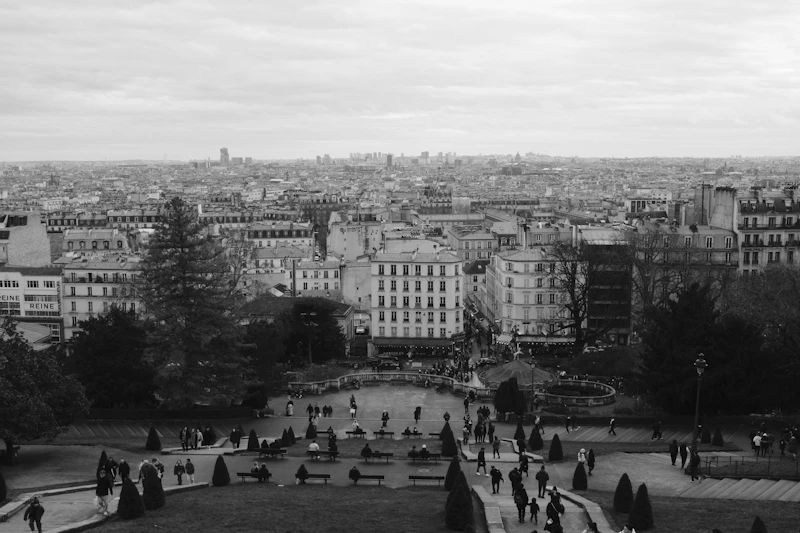 Cityscape with many buildings and people walking.