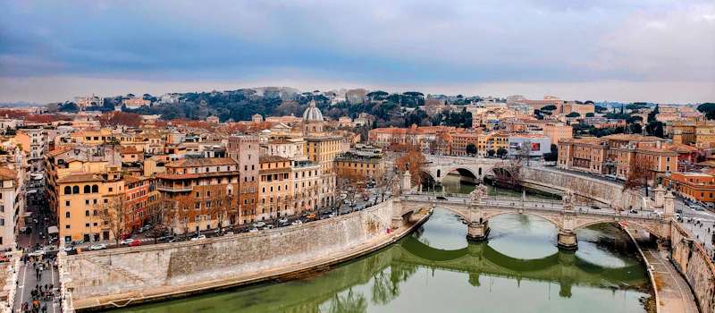 A river running through a city next to a bridge