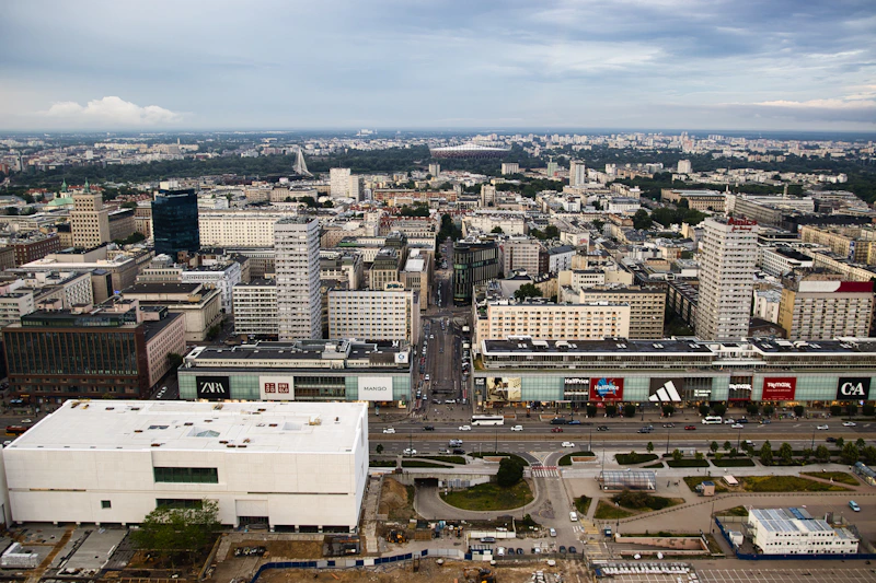 Aerial view of a sprawling cityscape with modern buildings.